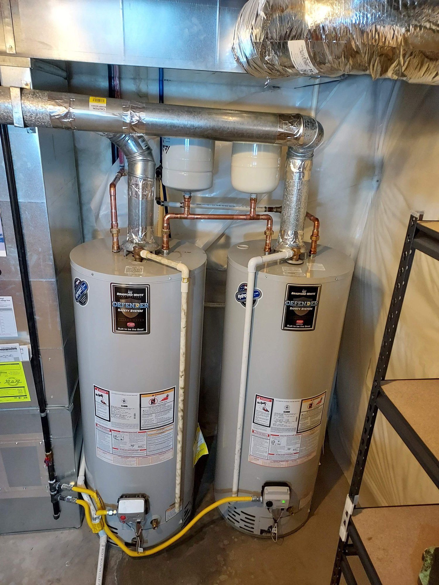Twin water heater installation with copper and gas line work