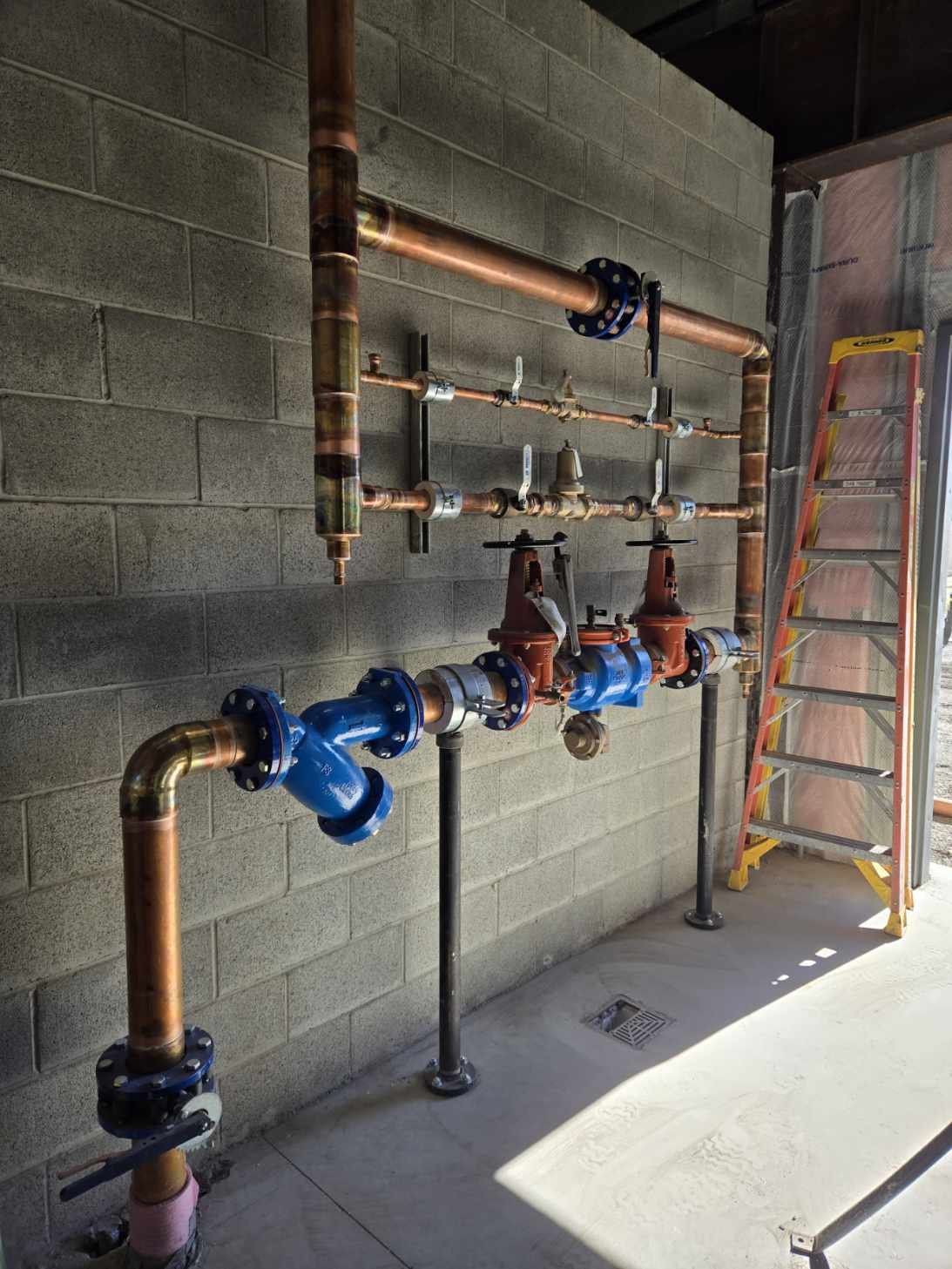 Hand-fitted copper plumbing, precisely installed